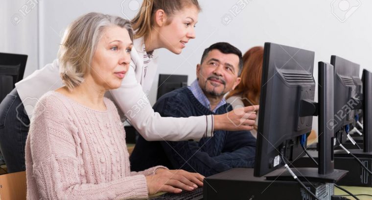 Young female coach giving computer lessons